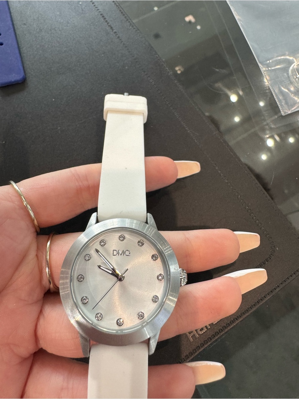 New DMQ Women’s silver tone & white Watch w Crystal Markers and rubber Strap.